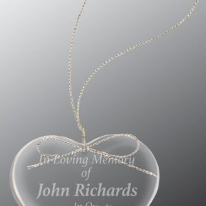 Import placeholder for 4508: Clear glass heart ornament with engraved text, cross design, and gold hanging string.
