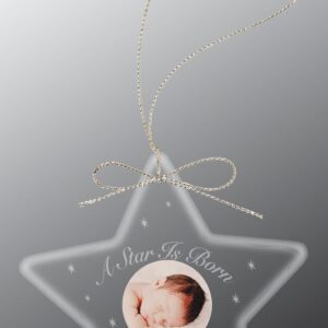 Clear star ornament with baby photo, gold string, and "A Star Is Born – McKenzie Rae" in white. Product: 4513.