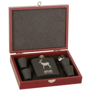 A boxed set, Import placeholder for 7096, includes a black antelope flask and four shot glasses in a wooden case.