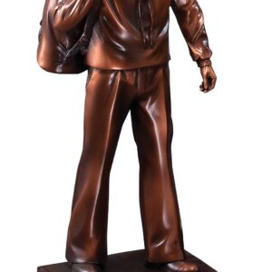 Import placeholder for 1112: Bronze sailor statue in uniform with duffel bag, mounted on a black base.