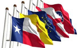 Four state flags—Texas, New Mexico, Indiana, and Tennessee—fly on poles with a white sky (Import placeholder for 1140).