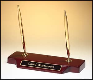 The Import placeholder for 1183 is a wooden desk nameplate with "Carol Westwood" and two gold pens on top.