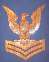 Import placeholder for 1416: Wooden eagle with outstretched wings above three chevrons on a dark background.