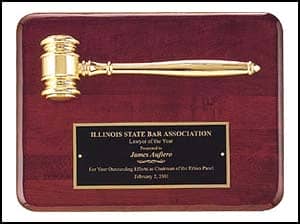 A wooden plaque with a gold gavel and a black plate reading "Import placeholder for 1458.
