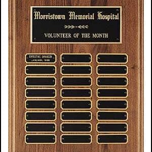 Wooden "Volunteer of the Month" plaque with engraved nameplate for Morristown Memorial Hospital.